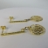 Brinco Médio De Fio Trabalhado e Flor Vazada Banhado em Ouro 18k - Dourado